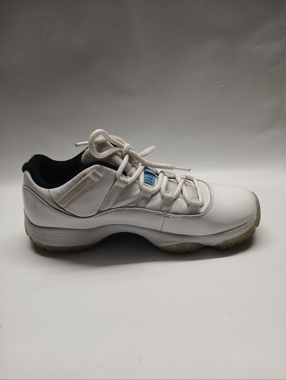 Jordan 11 Retro  Men's White and Black Low-Top Sneakers with Blue Accent